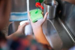 Washing the dishes with Dishwashing Liquid